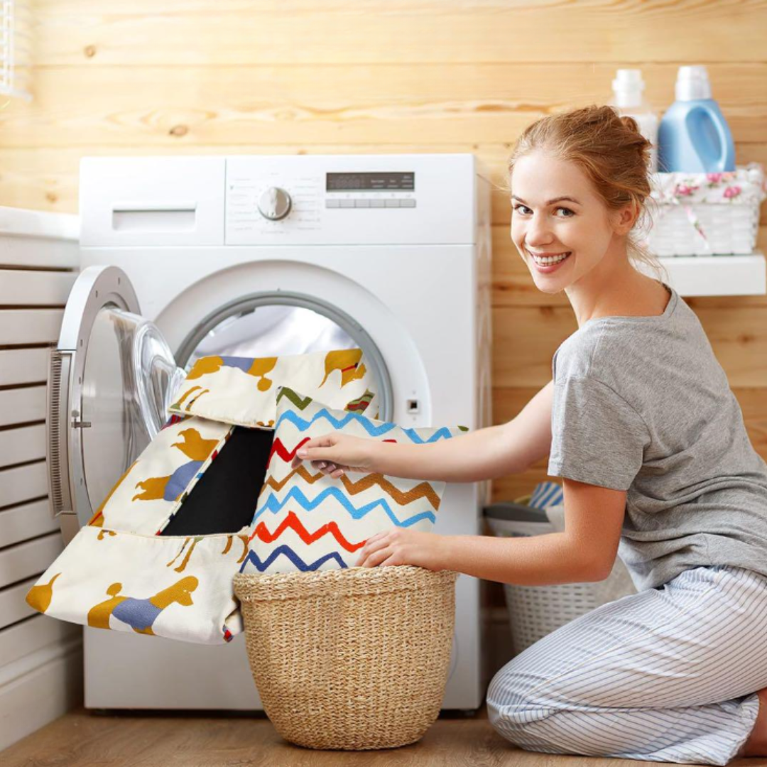 Woman sorting laundry in a laundry room with a Sofa Dog Bed – Washable, Anti-Chew washing machine.  Ultra Soft & Detachable