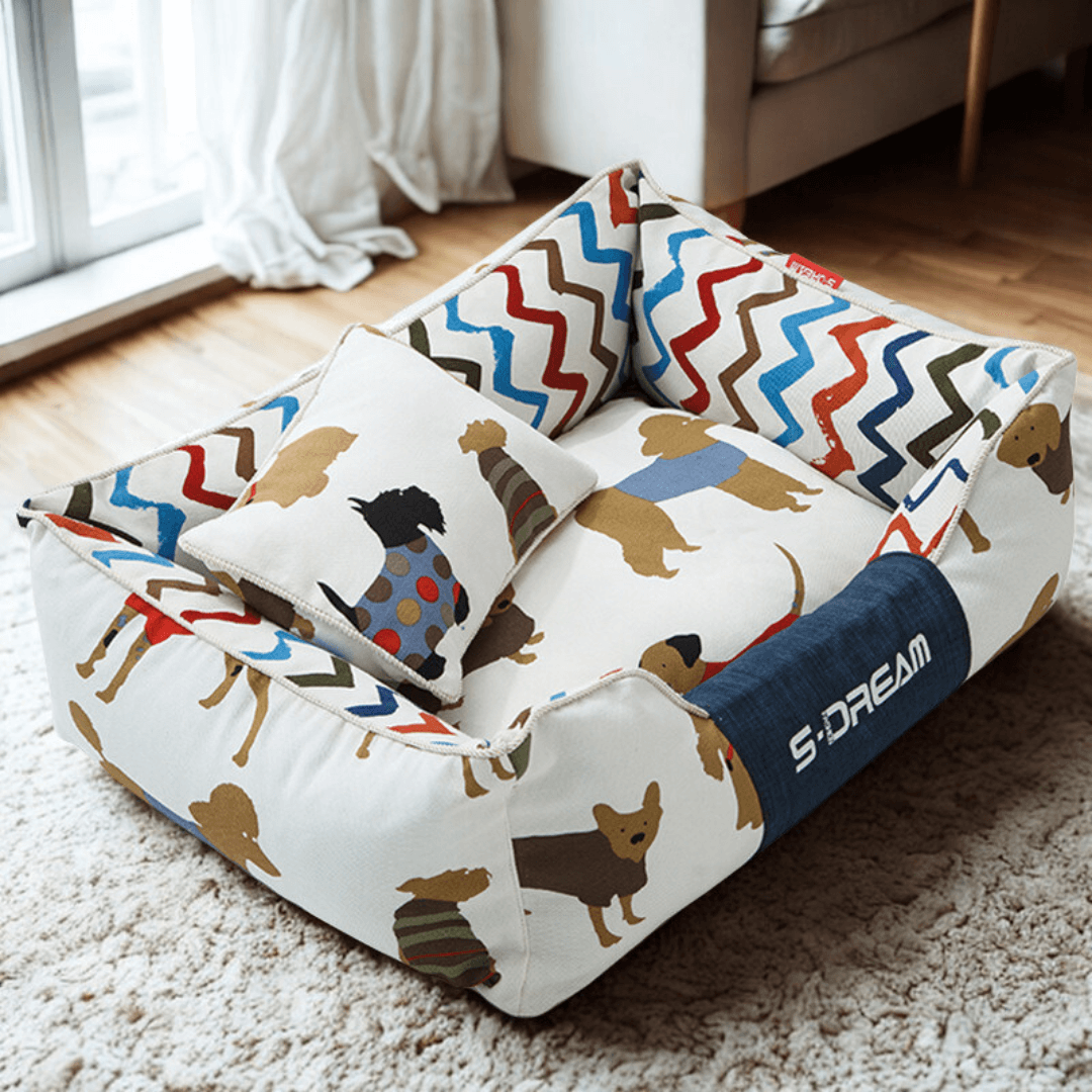  Sofa Dog Bed – Washable, Anti-Chew, Ultra Soft & Detachable Colorful pet bed with dog pattern on a carpeted floor