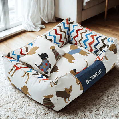  Sofa Dog Bed – Washable, Anti-Chew, Ultra Soft & Detachable Colorful pet bed with dog pattern on a carpeted floor