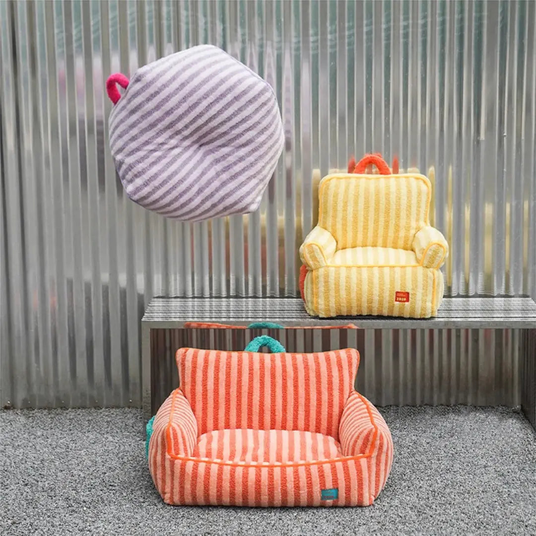 Two striped bean bags, one orange and one yellow with purple accents, against a metallic wall.
JoyPup Universal Sofa-Style Pet Bed – Soft Velvet, Cozy & Detachable,