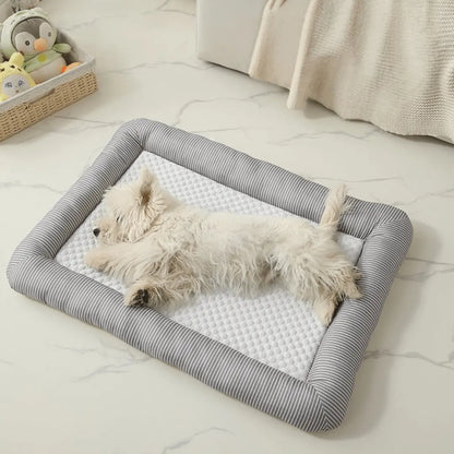 Cooling Dog Bed Small white dog lying on a striped cooling pet bed in a room with a light-colored floor.