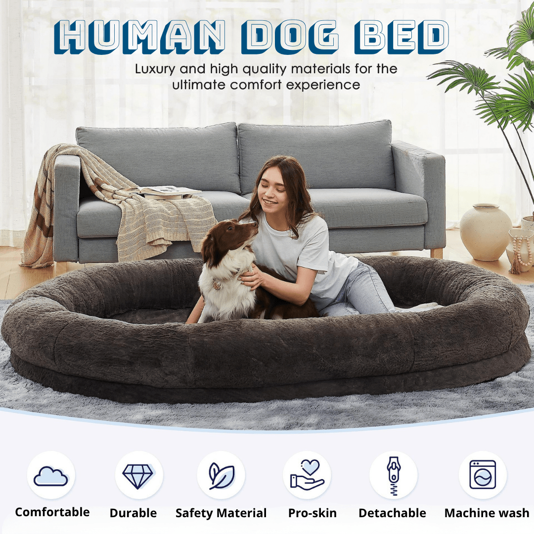 Human Dog Bed Woman with a dog in a large donut-shaped pet bed in a living room setting.