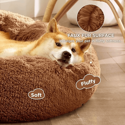 Soft Donut Cuddler Pet Bed - Ultimate Anti-AnxietyDog lying in a brown plush pet bed with text highlighting features.Joypup