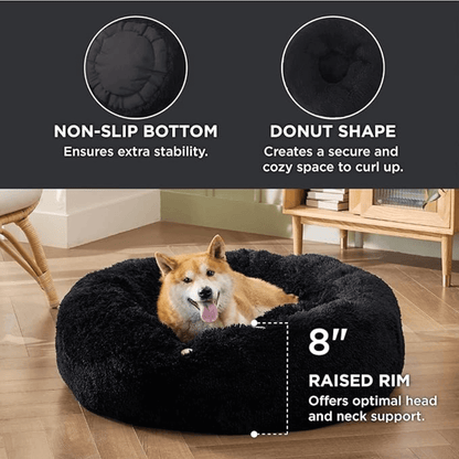 Soft Donut Cuddler Pet Bed - Ultimate Anti-AnxietyDog lying on a black donut-shaped pet bed with features highlighted.Joypup